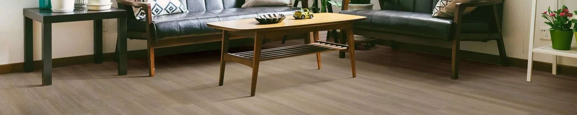 Living room with new wood-look flooring installed by Viva Floors & More